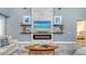 A modern living room with a contemporary fireplace and decorative shelves at 7407 Green St, Bradenton, FL 34201