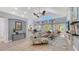 Spacious living room featuring a fan, lots of natural light, and tile flooring at 7407 Green St, Bradenton, FL 34201