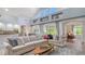 Bright living room featuring a kitchen view and lots of natural light at 7407 Green St, Bradenton, FL 34201