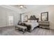 Beautiful main bedroom featuring stylish furnishings, tray ceilings, and a tranquil atmosphere for restful nights at 7407 Green St, Bradenton, FL 34201