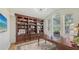 Office space with custom wood built-ins, decorative lighting and a wall-mounted television at 7407 Green St, Bradenton, FL 34201