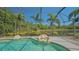 Screened lanai area features a pool with rock features and a scenic view of the outdoors at 7407 Green St, Bradenton, FL 34201