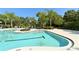 Relaxing community pool surrounded by lush landscaping and comfortable lounge chairs at 7407 Green St, Bradenton, FL 34201
