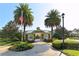 Community pool entrance with an American flag, beautiful landscaping, and a welcoming gate at 7407 Green St, Bradenton, FL 34201