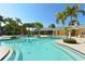 Large community pool with beach style entry and splash pad at 7407 Green St, Bradenton, FL 34201