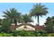 University Place community sign nestled among lush greenery and palm trees for a welcoming entrance at 7407 Green St, Bradenton, FL 34201