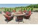 Cozy outdoor fire pit surrounded by comfortable wicker chairs, perfect for socializing outdoors at 7554 Camden Harbour Dr, Bradenton, FL 34212
