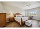 Spacious main bedroom with wood floors, natural lighting, and elegant furniture at 7554 Camden Harbour Dr, Bradenton, FL 34212