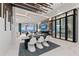 Elegant dining room with designer lighting and direct access to waterfront views at 800 Blue Shell Loop, Sarasota, FL 34240