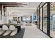 Open concept dining and living spaces with marble flooring and waterfront views at 800 Blue Shell Loop, Sarasota, FL 34240