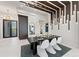 Dining area with unique lighting fixtures, art, and views of the waterfront at 800 Blue Shell Loop, Sarasota, FL 34240