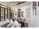 Dining room features a wine fridge, statement lighting, neutral decor and a modern design at 800 Blue Shell Loop, Sarasota, FL 34240