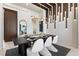 Dining room features designer lighting fixture, neutral decor and a modern design at 800 Blue Shell Loop, Sarasota, FL 34240