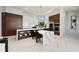 Gourmet kitchen features marble countertops, breakfast bar, pendant lights, and high-end appliances at 800 Blue Shell Loop, Sarasota, FL 34240