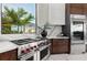 Modern kitchen with stainless steel appliances, and an outside view at 800 Blue Shell Loop, Sarasota, FL 34240