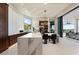 Gourmet kitchen features marble countertops, pendant lights, bar stools, and high-end appliances at 800 Blue Shell Loop, Sarasota, FL 34240