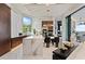 Gourmet kitchen features marble countertops, pendant lights, bar stools, and high-end appliances at 800 Blue Shell Loop, Sarasota, FL 34240