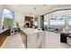 Spacious kitchen with a large waterfall island, stainless steel appliances, and seamless access to the outdoor living area at 800 Blue Shell Loop, Sarasota, FL 34240