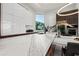 Gourmet kitchen featuring marble countertops, stainless steel appliances, and a view of the outdoors at 800 Blue Shell Loop, Sarasota, FL 34240