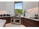 Beautiful kitchen featuring stainless steel appliances, marble countertops, custom cabinets, and a Wolf range at 800 Blue Shell Loop, Sarasota, FL 34240