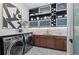 Well-appointed laundry room featuring modern appliances, ample storage, and stylish countertop with sink at 800 Blue Shell Loop, Sarasota, FL 34240