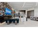 Elegant living room featuring a fireplace, custom wine storage, and contemporary decor at 800 Blue Shell Loop, Sarasota, FL 34240