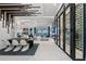 Bright, open living space features dining area, wine cellar, and large glass doors with gorgeous waterfront views at 800 Blue Shell Loop, Sarasota, FL 34240