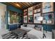 Unique themed living area features comfortable seating, a wet bar, and stylish design elements throughout at 800 Blue Shell Loop, Sarasota, FL 34240