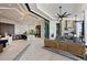 Open-concept space connecting the living area and kitchen, extending to an outdoor patio and waterfront view at 800 Blue Shell Loop, Sarasota, FL 34240