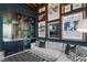 Beautifully designed living area featuring a stylish wet bar, comfortable seating, and unique themed decor at 800 Blue Shell Loop, Sarasota, FL 34240