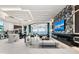 Open-concept space offers modern design, water views, gourmet kitchen, and living area at 800 Blue Shell Loop, Sarasota, FL 34240