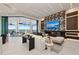 Open concept living room flows outside with a disappearing wall, showcasing stunning water views at 800 Blue Shell Loop, Sarasota, FL 34240