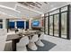 Open living space features dining area, fireplace and entertainment center, and wine cellar at 800 Blue Shell Loop, Sarasota, FL 34240