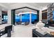 Bright living room with sleek decor opens to an outdoor living space with water views at 800 Blue Shell Loop, Sarasota, FL 34240