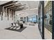 Bright, open-concept living space features dining area, wine cellar, and large glass doors to waterfront views at 800 Blue Shell Loop, Sarasota, FL 34240