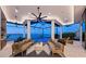 Inviting outdoor living area with ceiling fans, comfortable seating, and waterfront views at 800 Blue Shell Loop, Sarasota, FL 34240