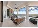 Covered patio with outdoor kitchen, lounge seating, and gorgeous water views for entertaining at 800 Blue Shell Loop, Sarasota, FL 34240
