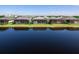 The backyard of this home has a screened-in lanai facing the pond and is located in an idyllic neighborhood at 8335 Sea Glass Ct, Sarasota, FL 34240