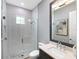 Bathroom featuring modern sink, vanity and a glass shower at 8335 Sea Glass Ct, Sarasota, FL 34240