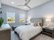Bedroom featuring neutral tones and natural light from two large windows at 8335 Sea Glass Ct, Sarasota, FL 34240
