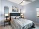 Comfortable bedroom with a ceiling fan and two side tables at 8335 Sea Glass Ct, Sarasota, FL 34240