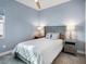 Cozy bedroom with neutral color palette, ceiling fan and two side tables at 8335 Sea Glass Ct, Sarasota, FL 34240