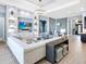 Living room with built-in shelving, modern lighting, and comfortable seating at 8335 Sea Glass Ct, Sarasota, FL 34240
