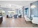 Bright, open living room features modern finishes, a beautiful view, and a stylish chandelier at 8335 Sea Glass Ct, Sarasota, FL 34240