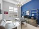 Bright home office with modern furnishings, stylish shelving, and ample natural light at 8335 Sea Glass Ct, Sarasota, FL 34240