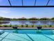 The beautiful backyard pool has exquisite fountain features and an amazing lake view for relaxing and unwinding at 8335 Sea Glass Ct, Sarasota, FL 34240