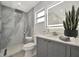 Modern bathroom with stylish shower, updated vanity, designer mirror, and elegant fixtures at 8419 Sylvan Woods Dr, Sarasota, FL 34243