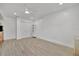 Bright bedroom with wood-look flooring, a ceiling fan, and a spacious closet for ample storage at 8419 Sylvan Woods Dr, Sarasota, FL 34243