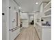 Bright kitchen with white cabinets, stainless steel appliances, and decorative backsplash at 8419 Sylvan Woods Dr, Sarasota, FL 34243