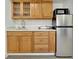 The kitchenette features stainless steel appliances, wood cabinets, and a modern countertop at 8419 Sylvan Woods Dr, Sarasota, FL 34243